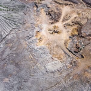 pexels photo 288096 288096 1 An expansive aerial view of a mining site displaying machinery and earth patterns.