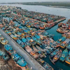 pexels photo 3030015 3030015 A vibrant aerial shot of fishing boats docked at Diu harbor, India, showcasing maritime life.